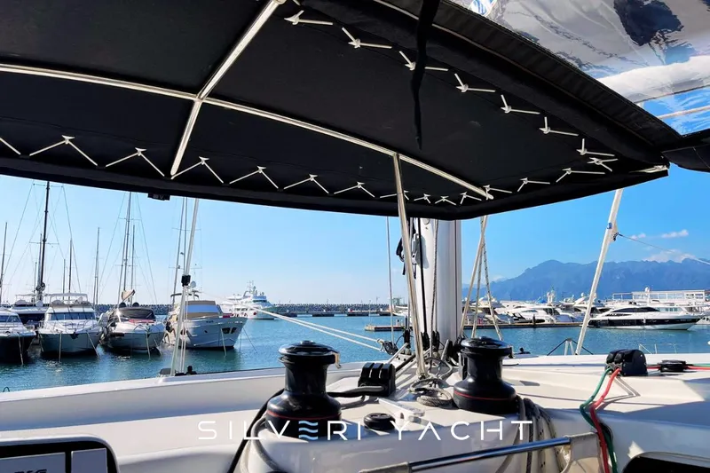  Yacht Photos Pics Lagoon 42 yacht cockpit view, marina backdrop, clear sky, 2019 model.