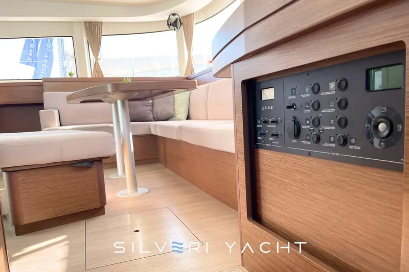  Yacht Photos Pics Luxurious interior of 2019 Lagoon 42 yacht with modern seating and control panel.