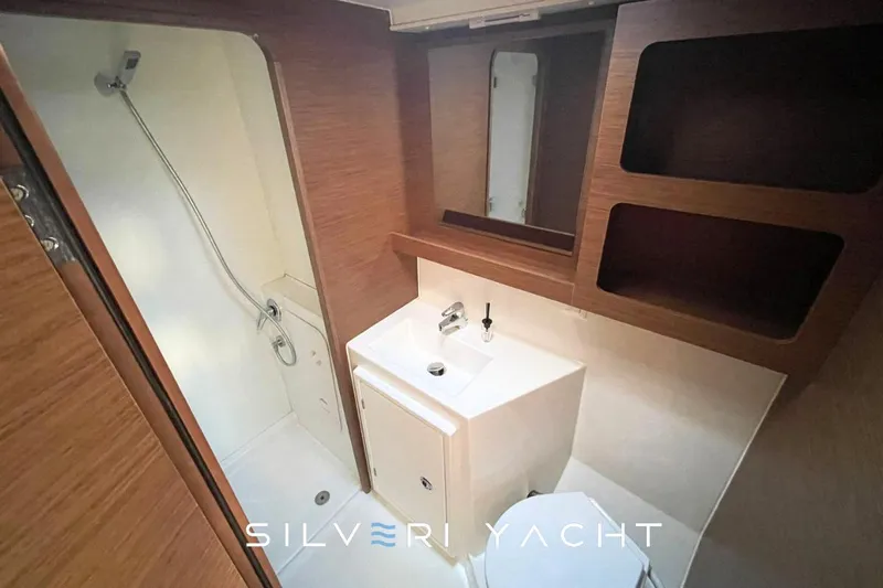  Yacht Photos Pics Modern bathroom in 2019 Lagoon 42 yacht with shower, sink, and toilet.