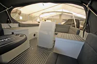 Interior of 2024 Maxima 740 boat with modern seating and sleek design.