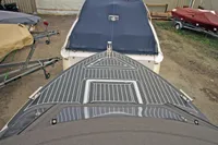 2024 Maxima 740 boat with sleek deck design in storage area.