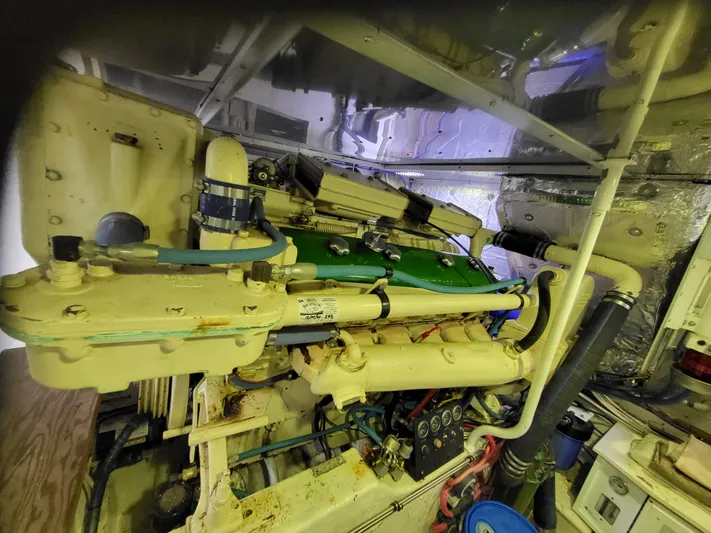 Savoy Yacht Photos Pics Engine room of a 1970 Chris-Craft Commander boat, showcasing mechanical components and piping.