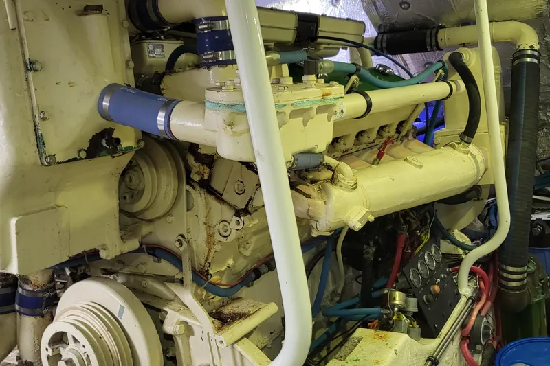 Savoy Yacht Photos Pics Engine room of a 1970 Chris-Craft Commander boat, showcasing mechanical components and piping.