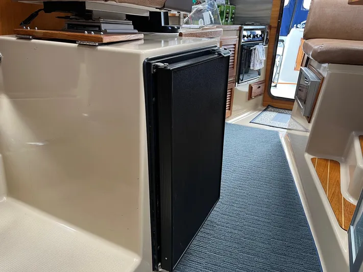  Yacht Photos Pics Interior of 2012 Ranger Tugs R-29 boat, featuring a compact kitchen area.