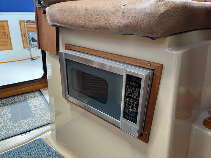  Yacht Photos Pics Built-in microwave in 2012 Ranger Tugs R-29 boat interior.