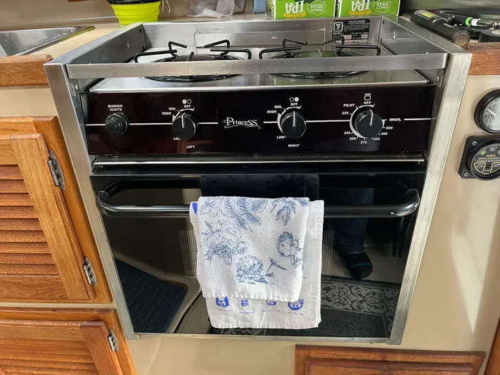 Yacht Photos Pics 2012 Ranger Tugs R-29 kitchen with a Princess stove and oven, featuring a floral towel.