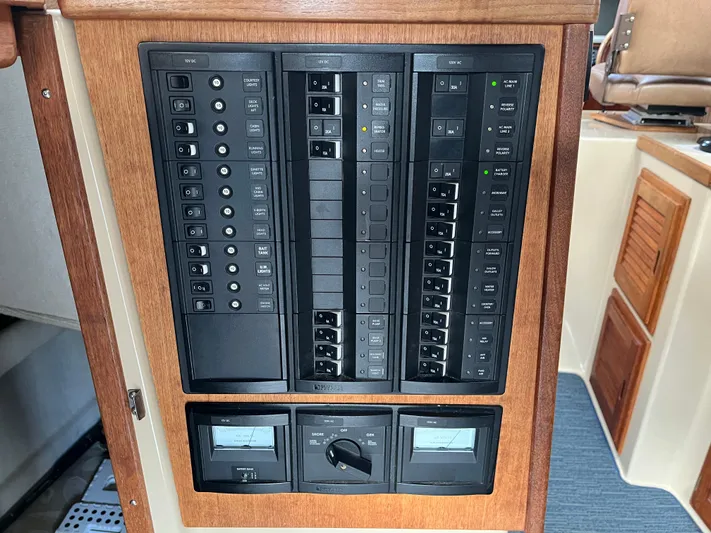  Yacht Photos Pics Electrical control panel on a 2012 Ranger Tugs R-29 boat, featuring switches and gauges.