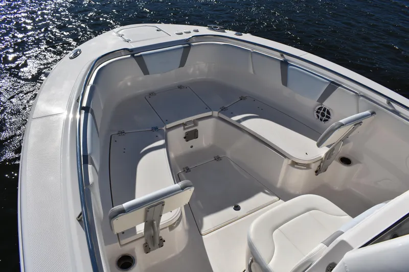  Yacht Photos Pics 2022 Robalo R272 Center Console boat interior with seating and storage compartments.
