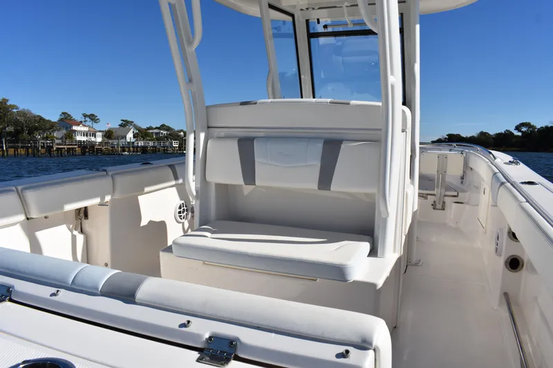  Yacht Photos Pics 2022 Robalo R272 Center Console boat interior with seating and console view.