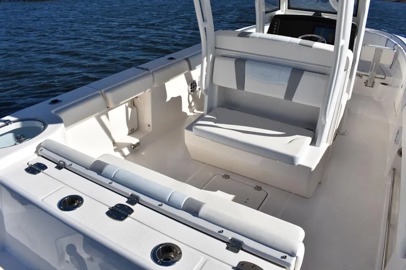  Yacht Photos Pics 2022 Robalo R272 Center Console boat interior with seating and rod holders.
