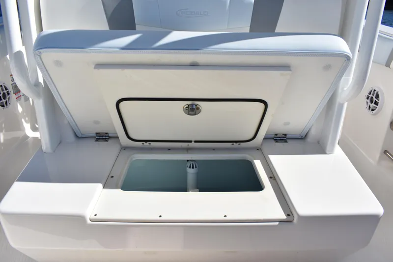  Yacht Photos Pics 2022 Robalo R272 Center Console boat with open storage compartment.