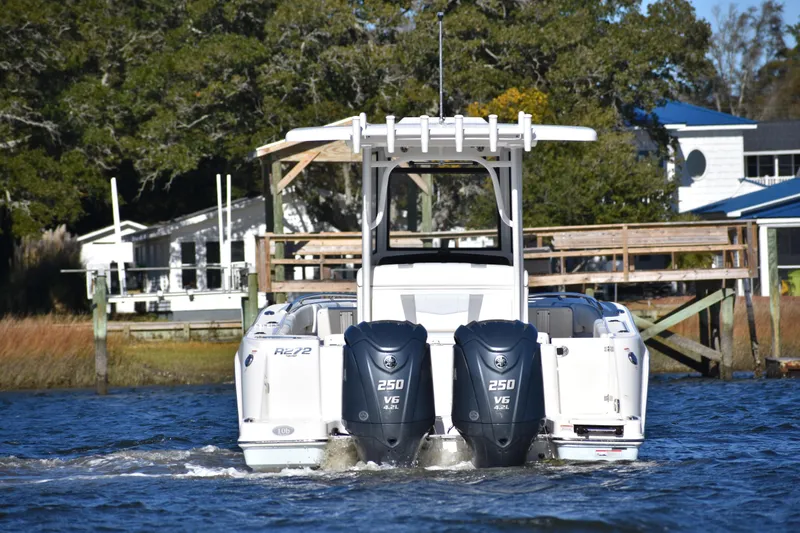  Yacht Photos Pics 2022 Robalo R272 Center Console boat with dual 250 V6 engines on water.