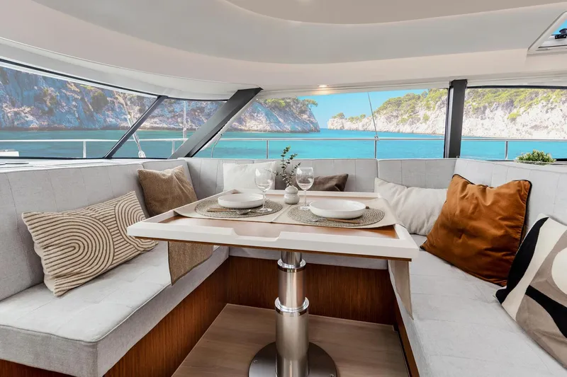  Yacht Photos Pics Luxurious interior of 2026 Moody 48DS yacht with scenic ocean view.