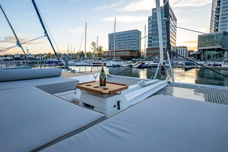  Yacht Photos Pics Luxurious Moody 48DS yacht deck with champagne, marina view, 2026 model.