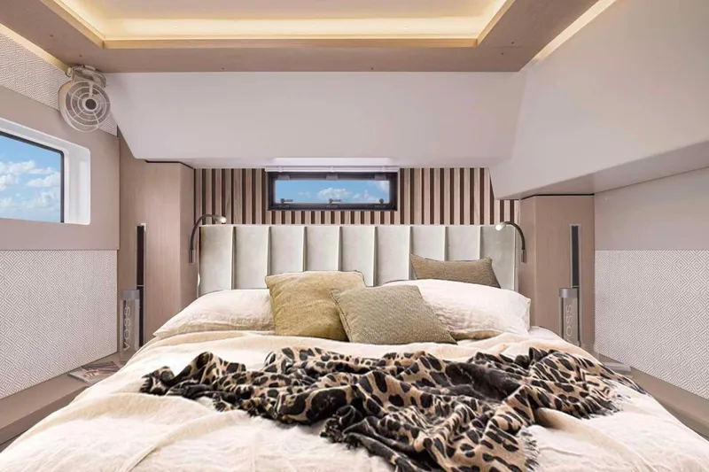  Yacht Photos Pics Luxurious bedroom interior of 2026 Moody 48DS yacht with elegant bedding and modern design.