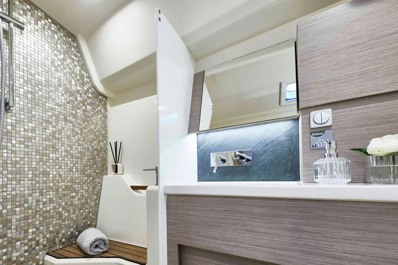  Yacht Photos Pics Luxurious bathroom in 2026 Moody 48DS yacht with modern fixtures and elegant design.