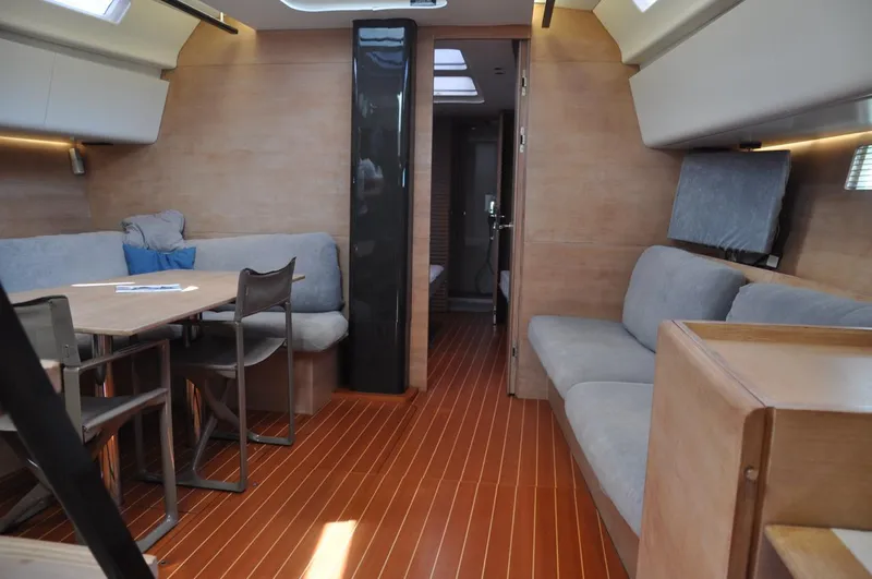  Yacht Photos Pics Interior of 2012 Nautor Swan 60 yacht with modern seating and wooden flooring.