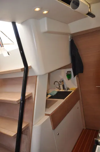  Yacht Photos Pics Interior of 2012 Nautor Swan 60 yacht, featuring a compact kitchen area.