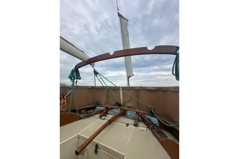 Solimar Yacht Photos Pics Cockpit view of 2000 Sam L. Morse Bristol Channel Cutter 28 sailboat under cloudy sky.