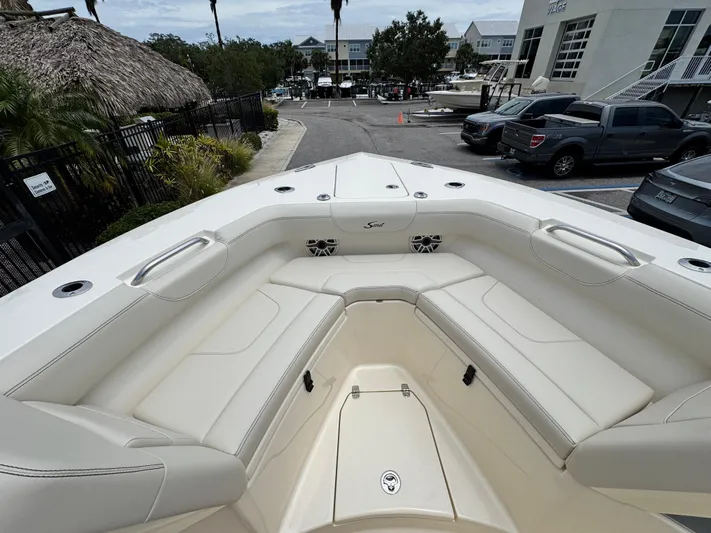  Yacht Photos Pics 2025 Scout 305 LXF boat interior with spacious seating and modern design.