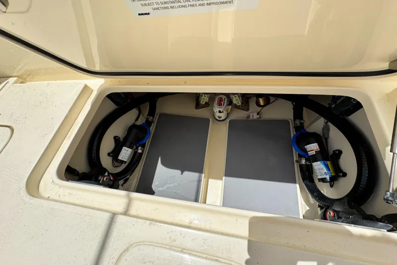  Yacht Photos Pics 2025 Scout 305 LXF boat compartment with visible wiring and components.