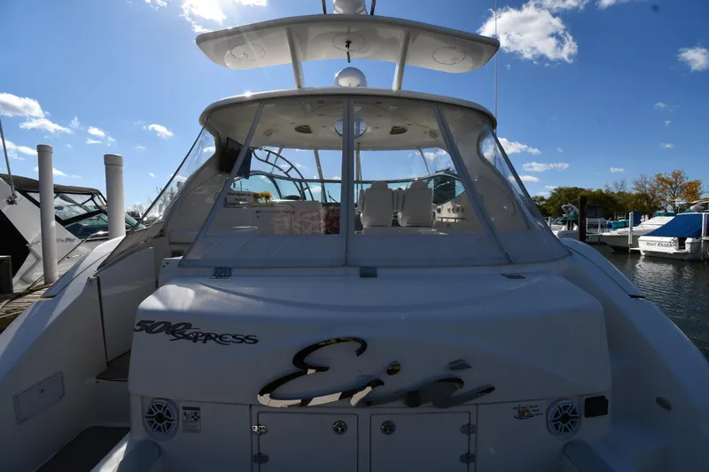  Yacht Photos Pics 2005 Cruisers Yachts 500 Express docked under a clear blue sky.