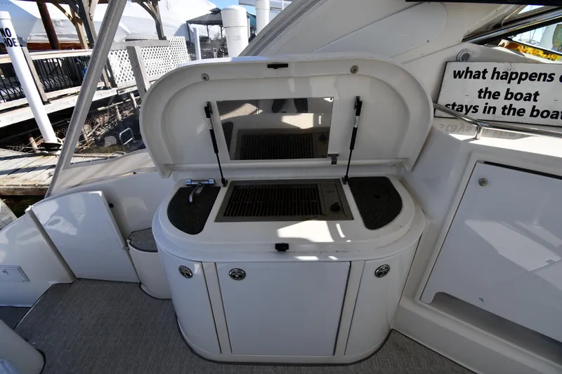  Yacht Photos Pics 2005 Cruisers Yachts 500 Express boat grill station with open lid and faucet.