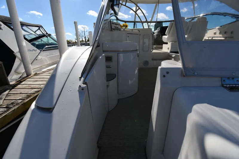  Yacht Photos Pics 2005 Cruisers Yachts 500 Express interior with seating and helm, docked under clear skies.