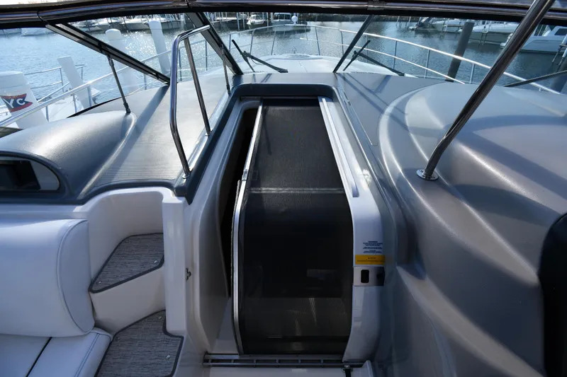  Yacht Photos Pics 2005 Cruisers Yachts 500 Express cockpit with sleek design and marina view.