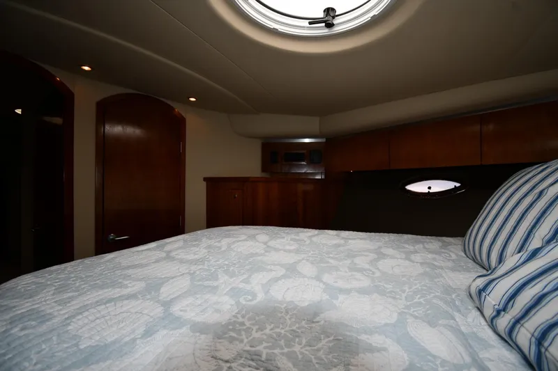  Yacht Photos Pics Luxurious cabin interior of 2005 Cruisers Yachts 500 Express with elegant wood finish.