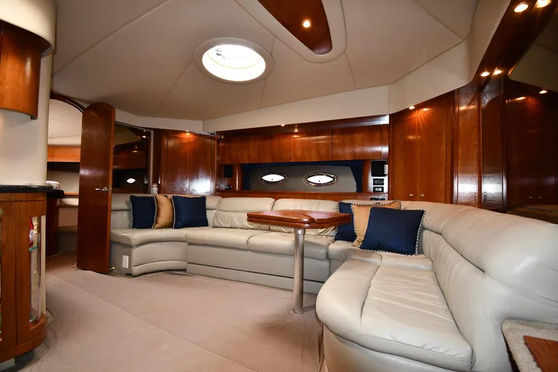  Yacht Photos Pics Luxurious interior of 2005 Cruisers Yachts 500 Express with leather seating and wood accents.