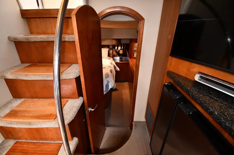  Yacht Photos Pics Interior of 2005 Cruisers Yachts 500 Express, featuring stairs and cozy cabin entrance.