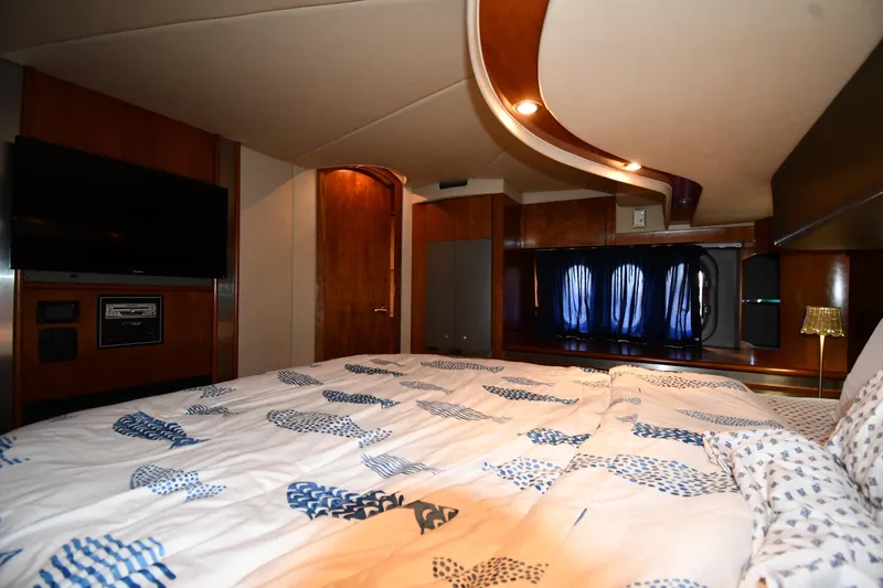  Yacht Photos Pics Luxurious bedroom interior of 2005 Cruisers Yachts 500 Express with modern amenities.