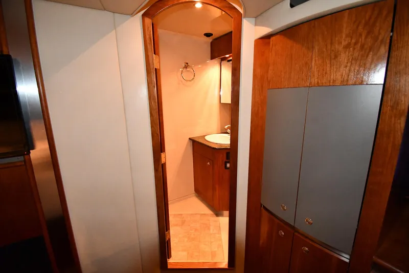  Yacht Photos Pics Interior of 2005 Cruisers Yachts 500 Express, featuring a wooden bathroom entrance.