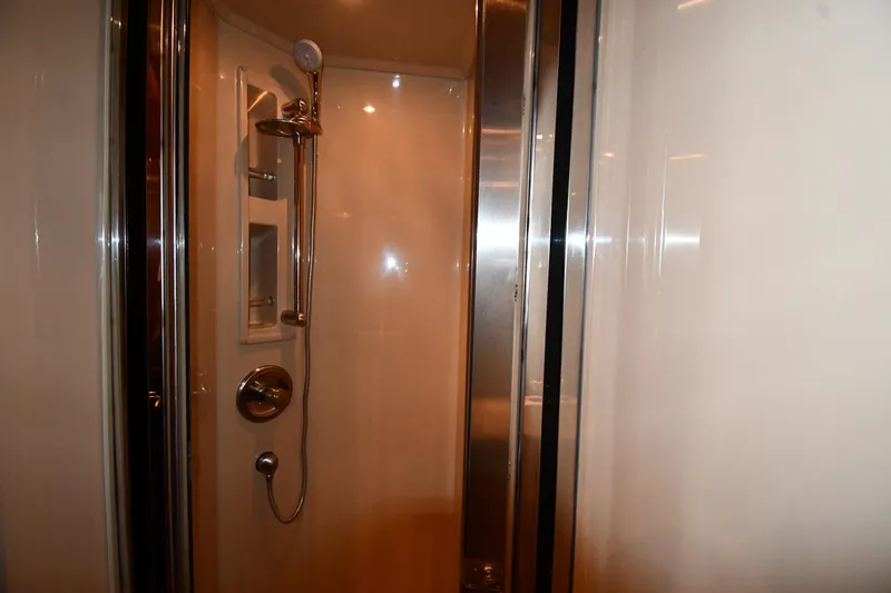  Yacht Photos Pics Shower area inside 2005 Cruisers Yachts 500 Express, featuring modern fixtures and sleek design.