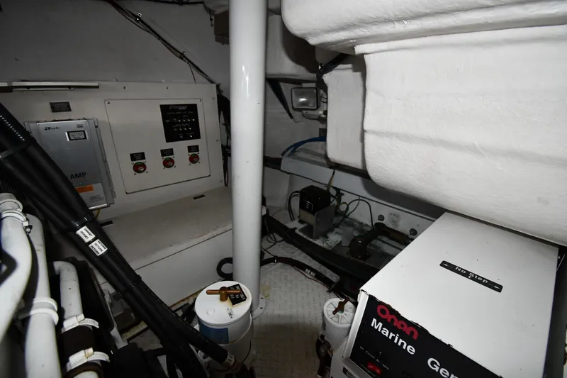  Yacht Photos Pics Engine room of 2005 Cruisers Yachts 500 Express with Onan marine generator and control panels.