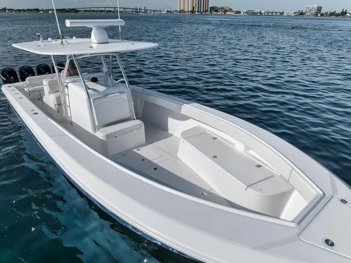  Yacht Photos Pics 2013 Bahama 41 boat on calm water, showcasing sleek design and spacious deck.