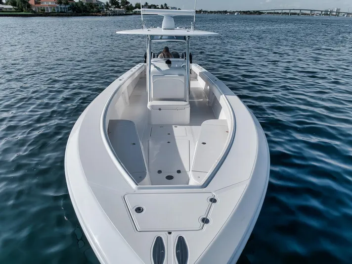  Yacht Photos Pics 2013 Bahama 41 boat on calm water, showcasing sleek design and spacious deck.