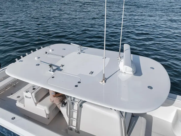  Yacht Photos Pics 2013 Bahama 41 boat on water, featuring sleek white design and spacious deck.