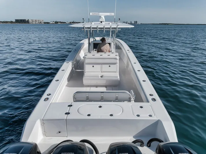  Yacht Photos Pics 2013 Bahama 41 boat on open water, featuring multiple outboard engines.