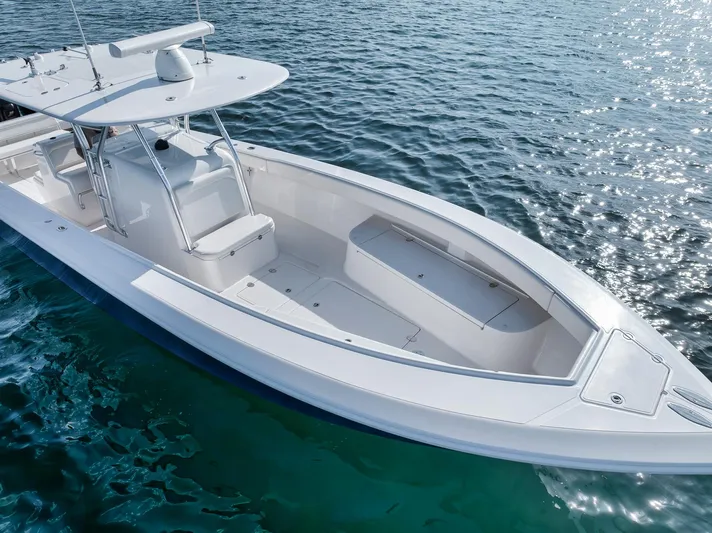  Yacht Photos Pics 2013 Bahama 41 boat on clear blue water, showcasing sleek design and spacious deck.