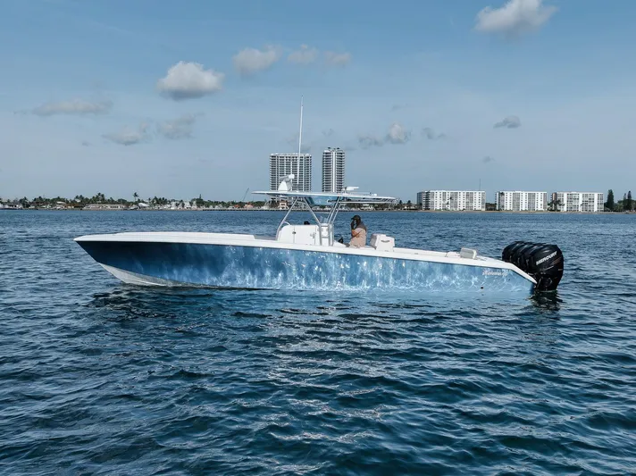  Yacht Photos Pics 2013 Bahama 41 boat on calm water with cityscape background.