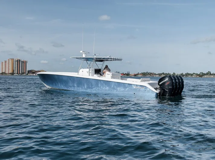 Yacht Photos Pics 2013 Bahama 41 boat on water with cityscape background.