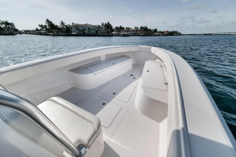  Yacht Photos Pics 2013 Bahama 41 boat with spacious deck, cruising on calm waters near a coastal area.