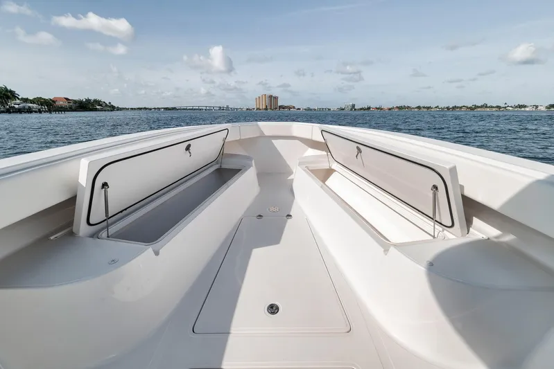  Yacht Photos Pics 2013 Bahama 41 boat deck with open storage, overlooking calm waters and distant skyline.