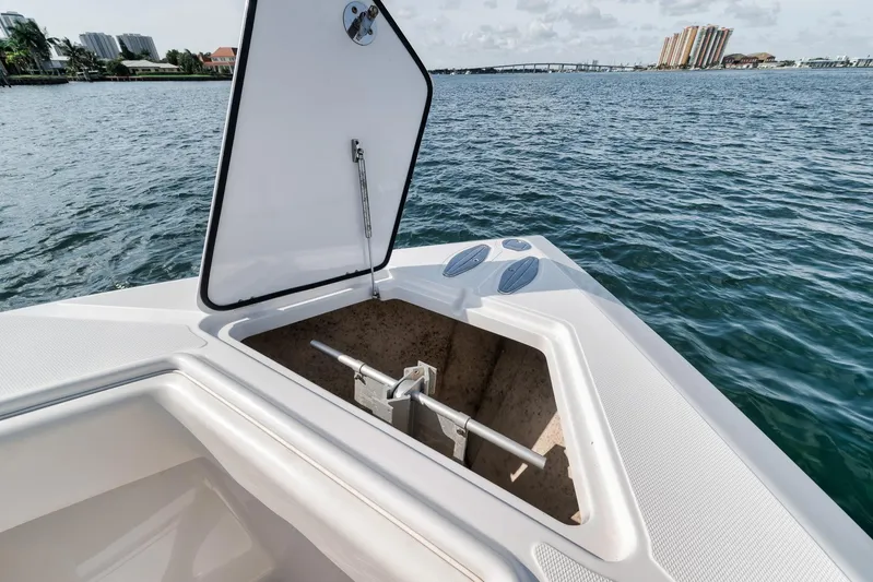  Yacht Photos Pics Open storage compartment on 2013 Bahama 41 boat, with ocean and cityscape in background.