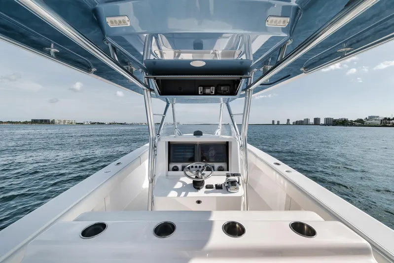  Yacht Photos Pics 2013 Bahama 41 boat interior with helm, ocean view, and clear sky.