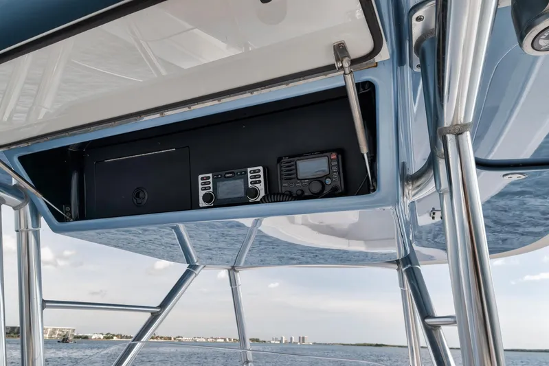  Yacht Photos Pics 2013 Bahama 41 boat console with navigation equipment, ocean view in background.