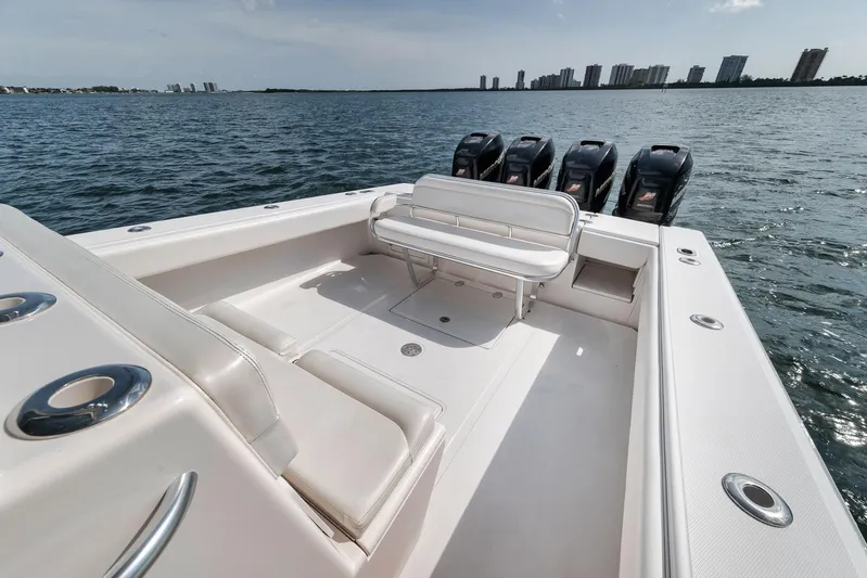  Yacht Photos Pics 2013 Bahama 41 boat with spacious deck and multiple outboard engines on open water.