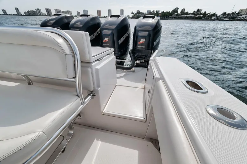  Yacht Photos Pics 2013 Bahama 41 boat with multiple Mercury outboard engines on a calm water backdrop.